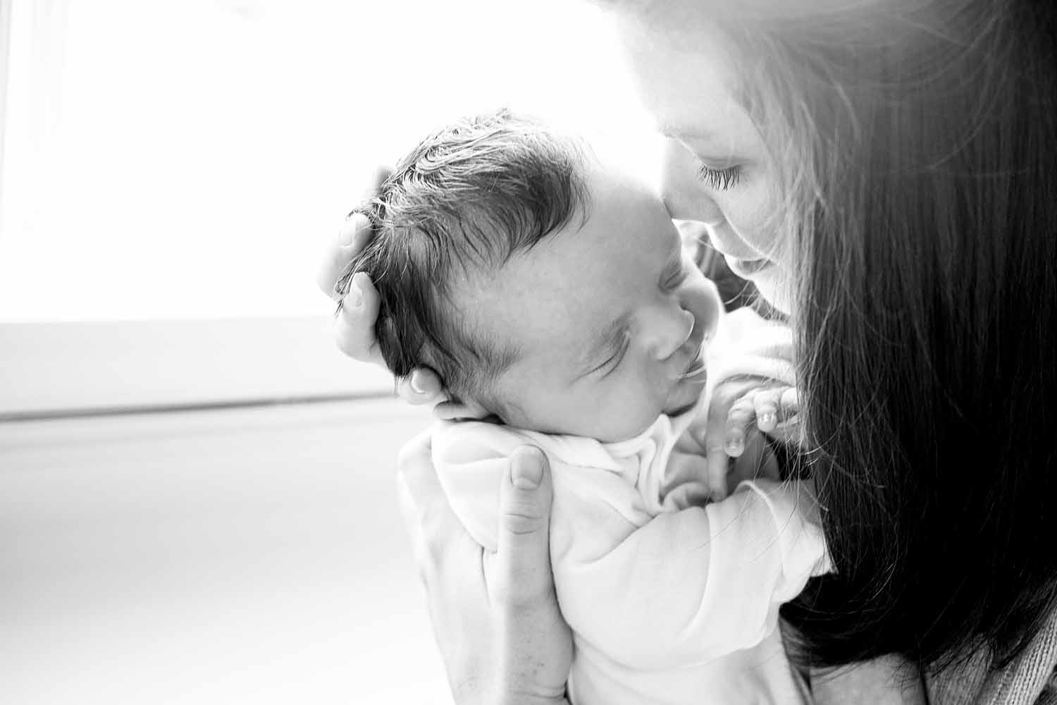 mom kissing her baby girl, CT Shoreline Newborn session