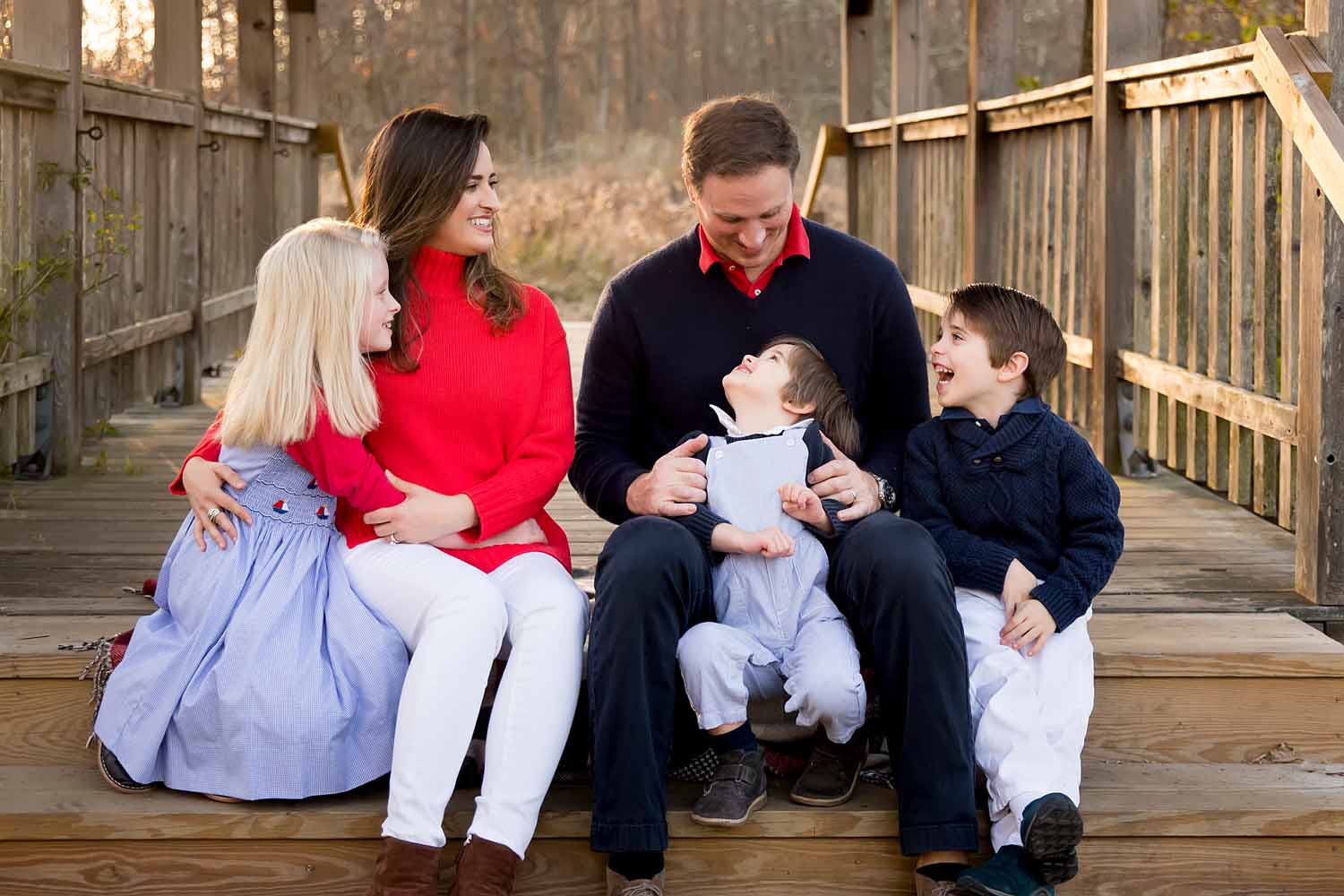 Family of five sitting and laughing together, Madison family photo shoot, CT Best Family Photographer