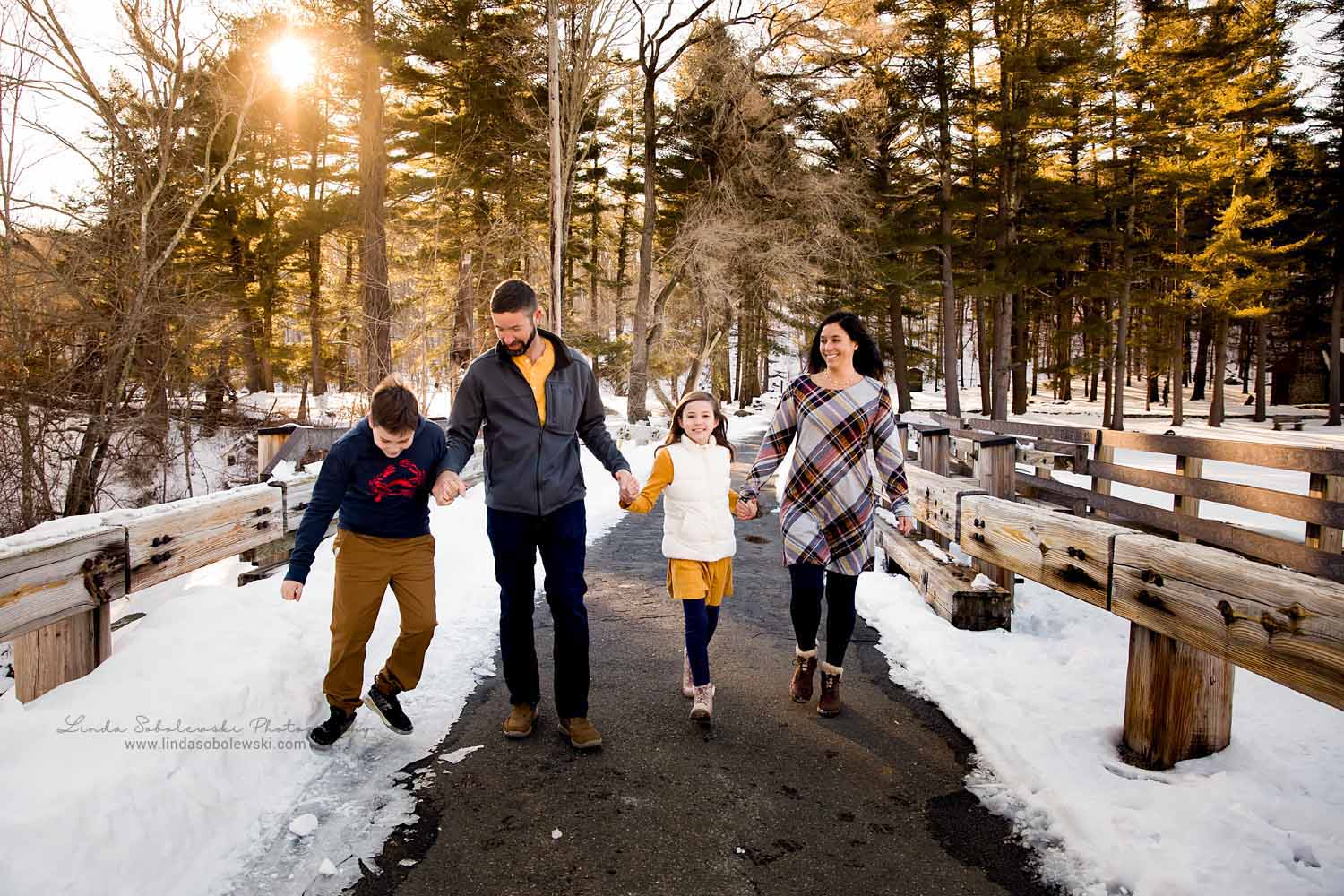 family of four holding hands, Family session in the snow, CT Family Photographer