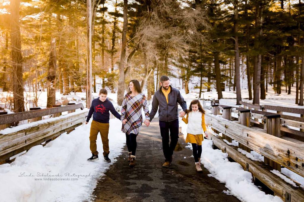 family of four holding hands, Family session in the snow, CT Family Photographer
