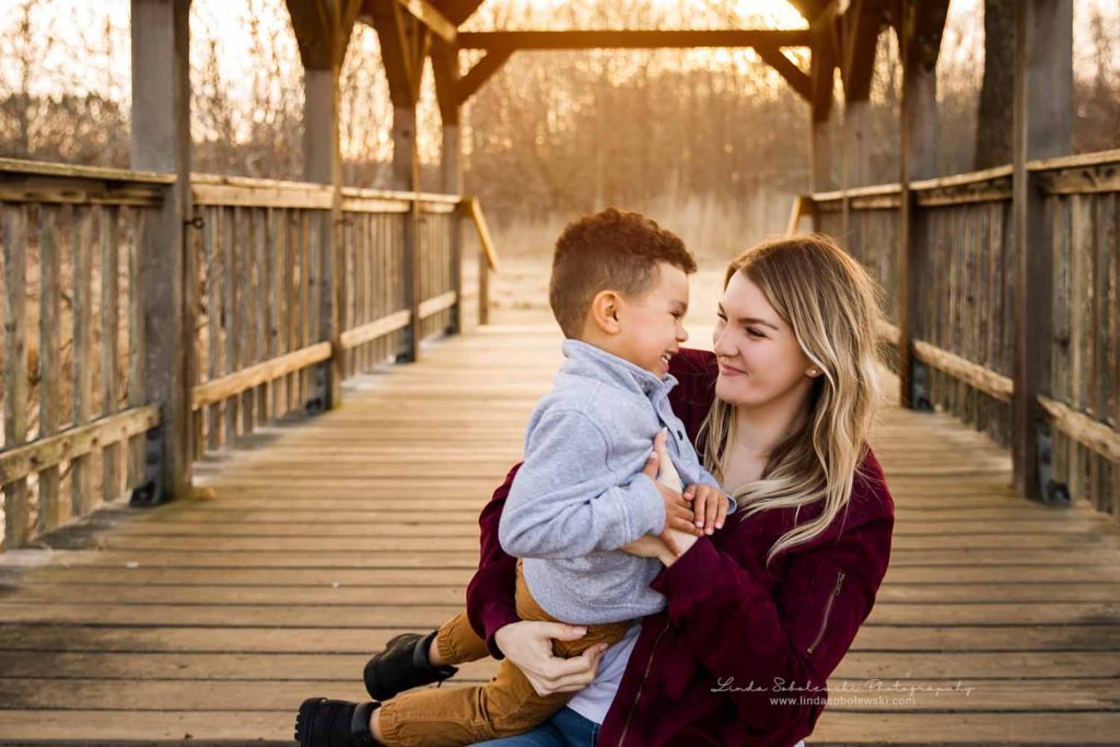 Blonde woman smiling at her little boy,Bauer Park Photo Session, CT Shoreline Family Photographer