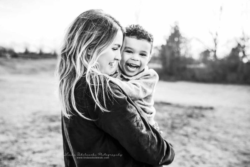 black and white image of a mom holding her little boy, CT family photography session