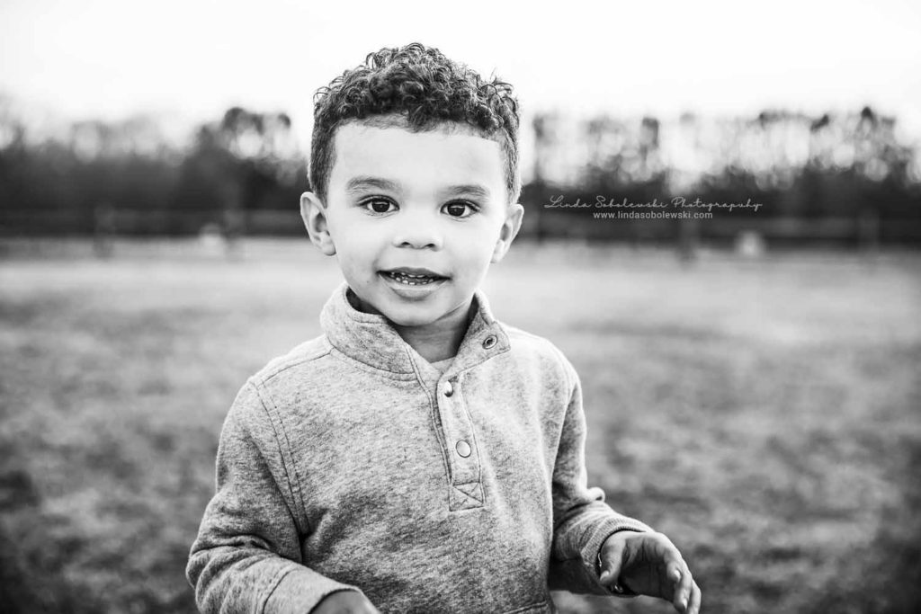 black and white image of a little boy,Madison, CT Family Photographer