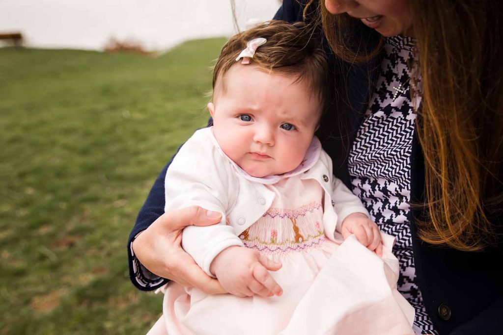baby in pink dress and white bow, Old Lyme Family photographer