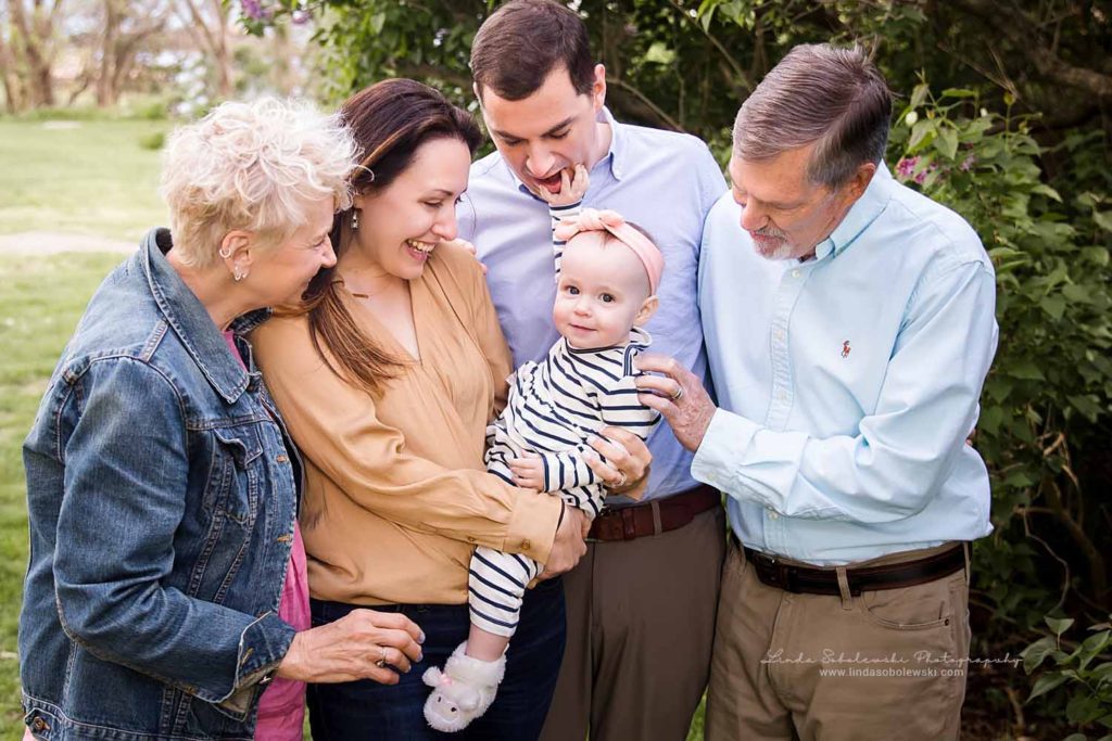 grandparents and parents smiling with their baby girl, Chaffinch Island Family Photography session