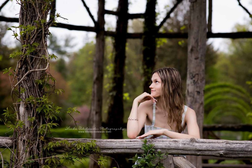Teenage girl sitting in a gazebo, Senior Photography Session at Elizabeth State Park, Old Saybrook, CT Photographer