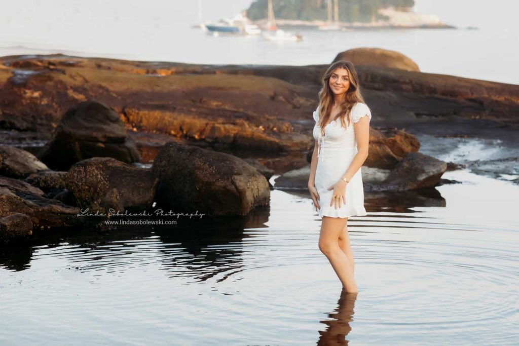 teenage girl standing in a tidal pool, CT high school senior photo shoot