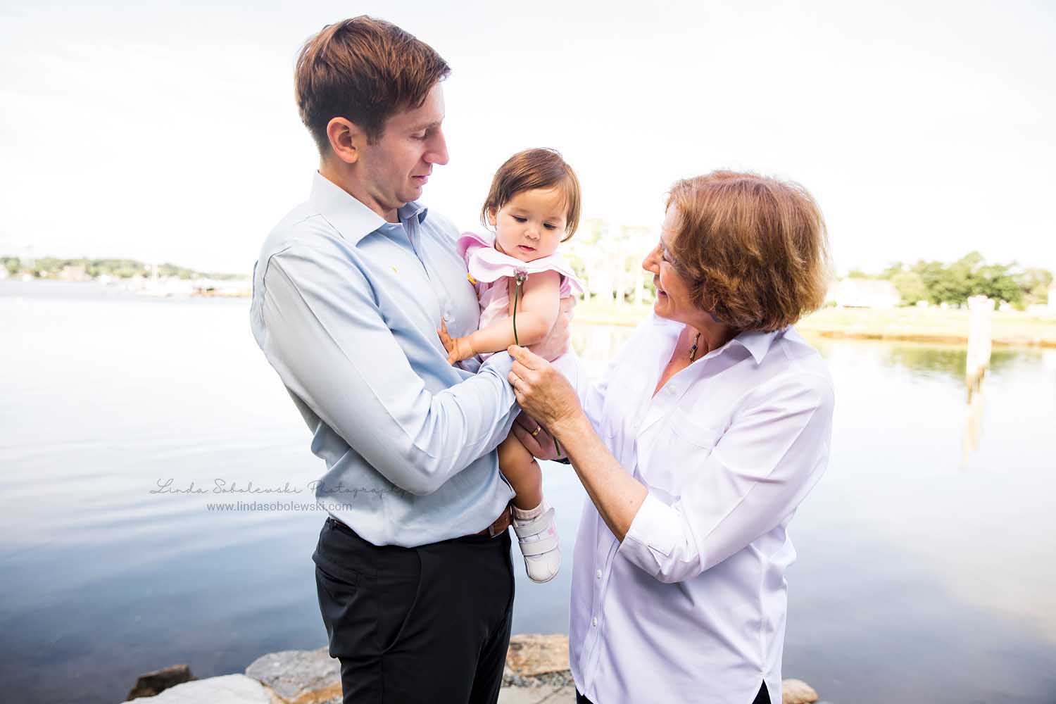 son and his mom giving a flower to a baby girl, Big Family Photo Shoot