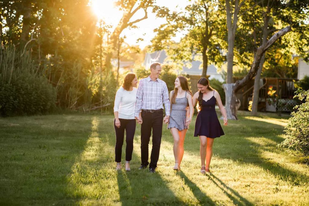 family of four walking together in the sunlight, Beautiful Family photography session