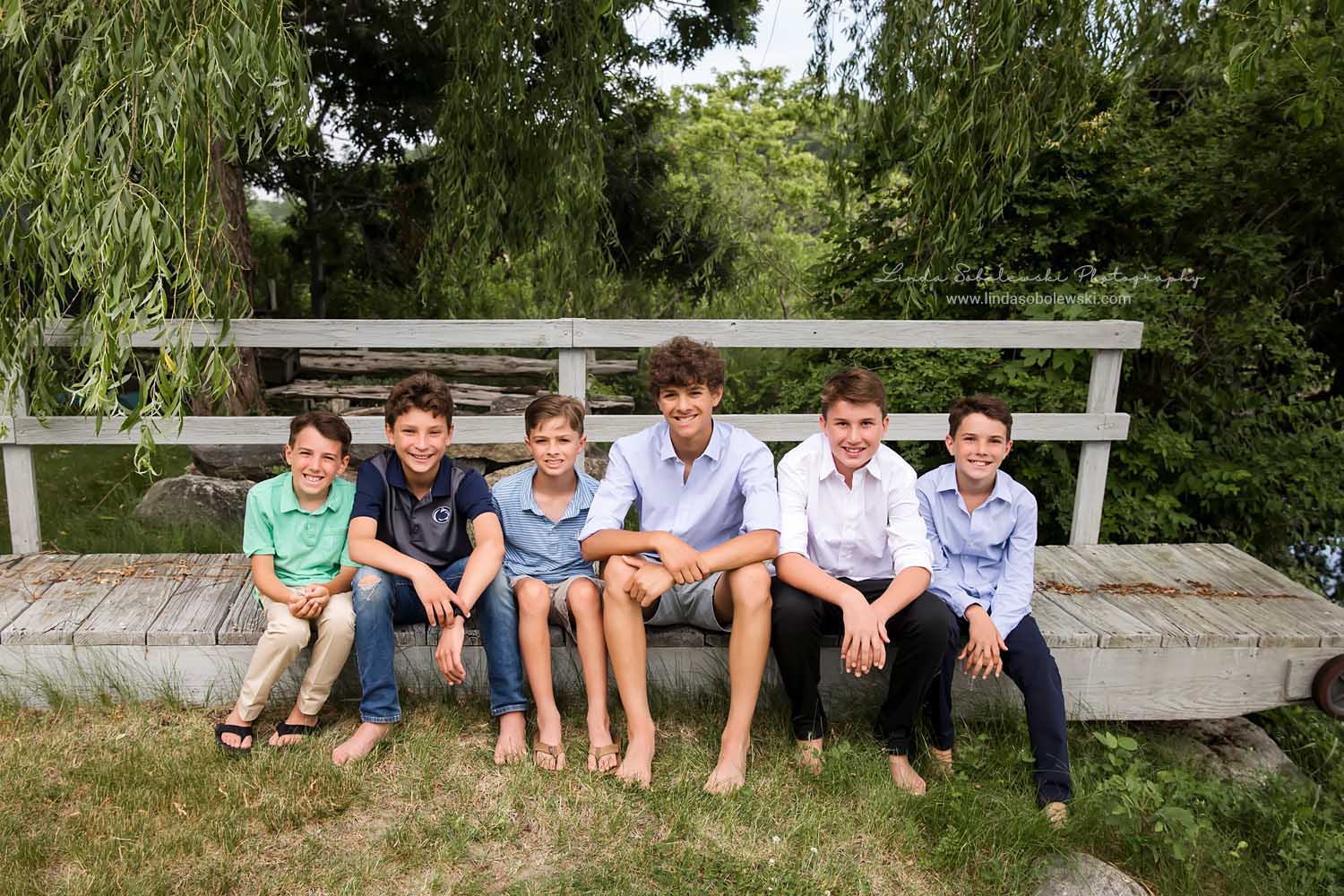 six boys sitting on a dock, CT Family photographer