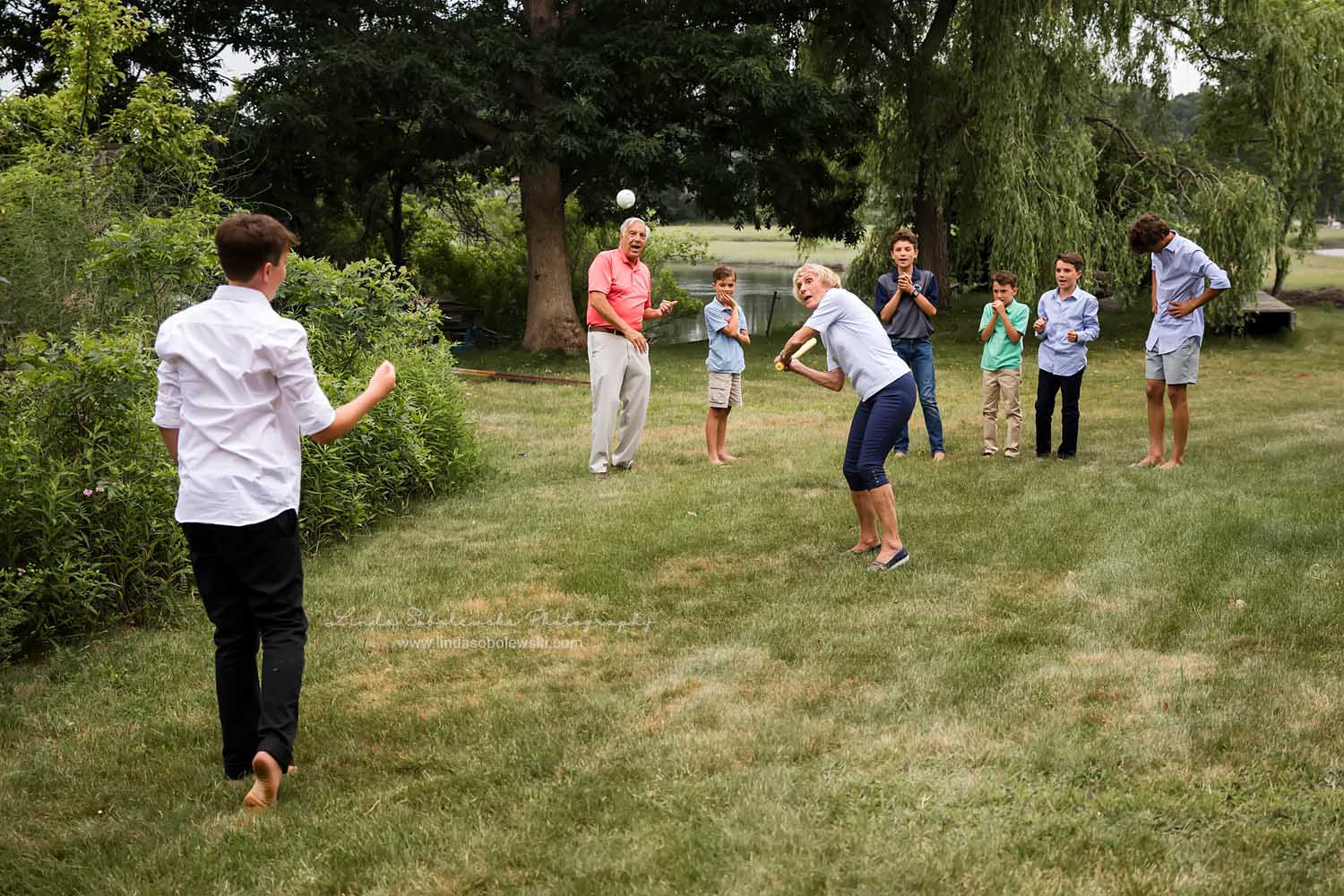 grandparents playing wiffle ball with their grandchildren, Family reunion photo session, CT Family Photographer