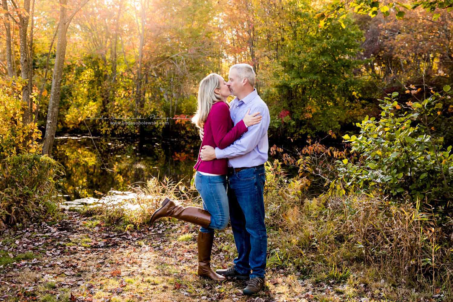 husband and wife kissing, Fall Family Photos at Bauer Park, Madison, CT photograher