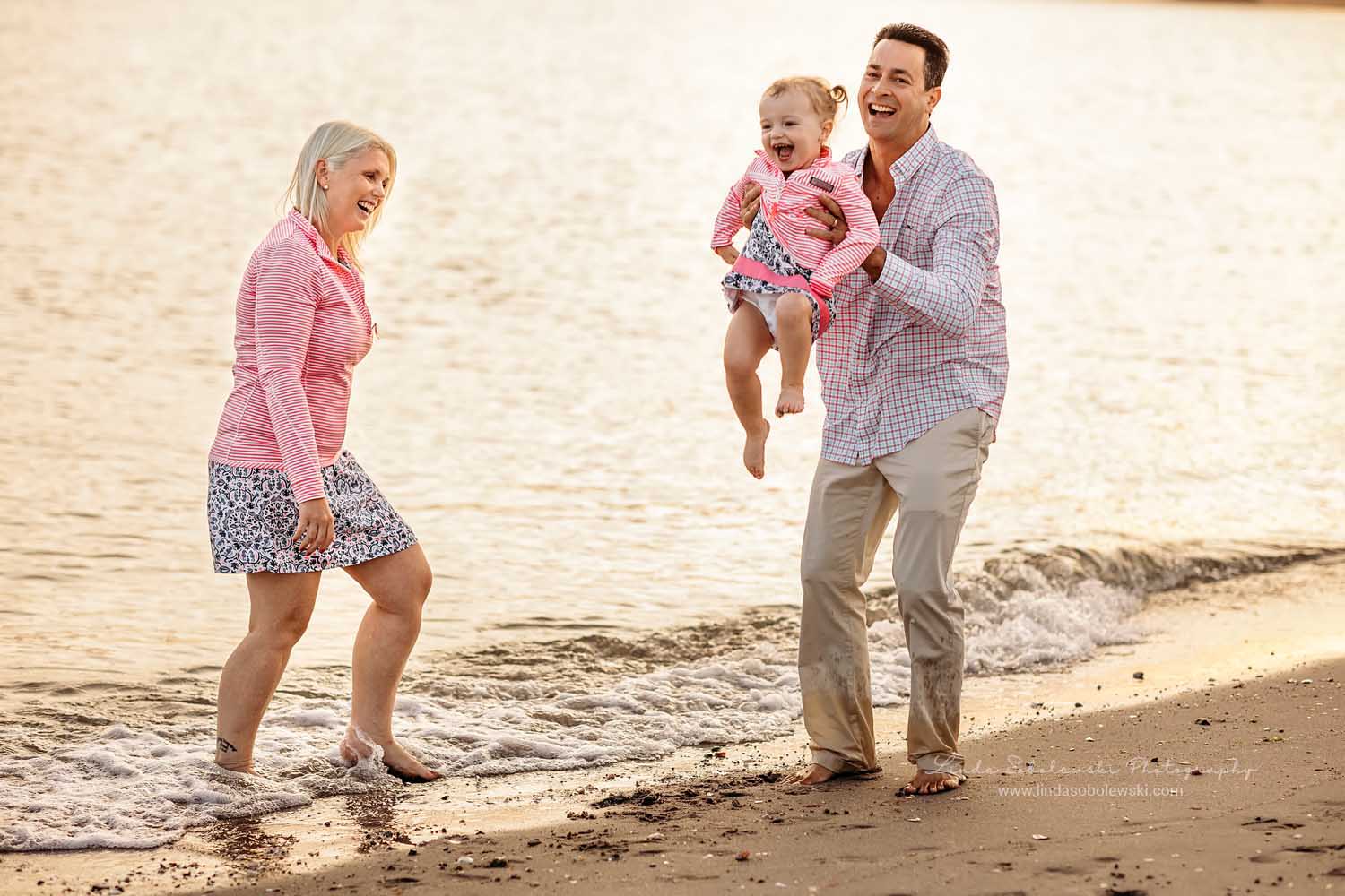 family of three playing together, CT shoreline beautiful family photography session