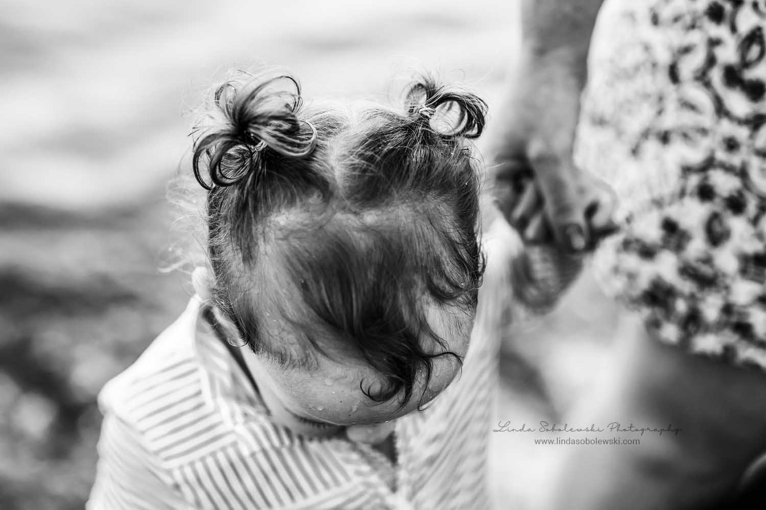 black and white image of a baby's pigtails, CT Beach photographer