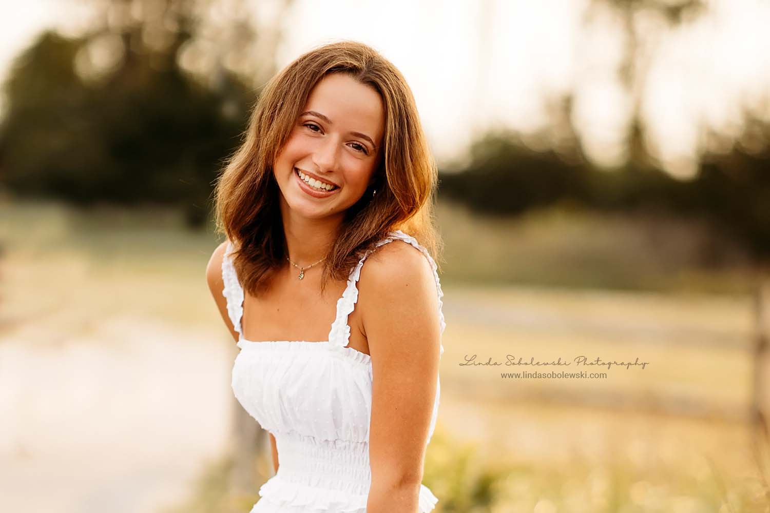 girl in white dress laughing, Madison CT senior photographer