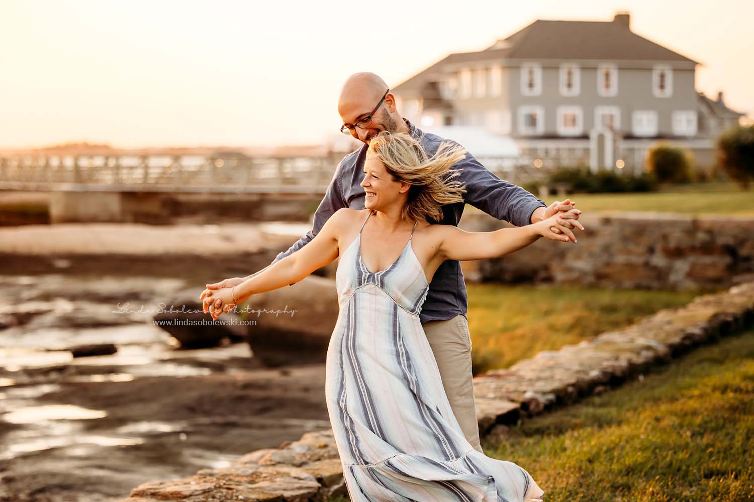 Couple laughing and holding hands, Madison, CT photography session