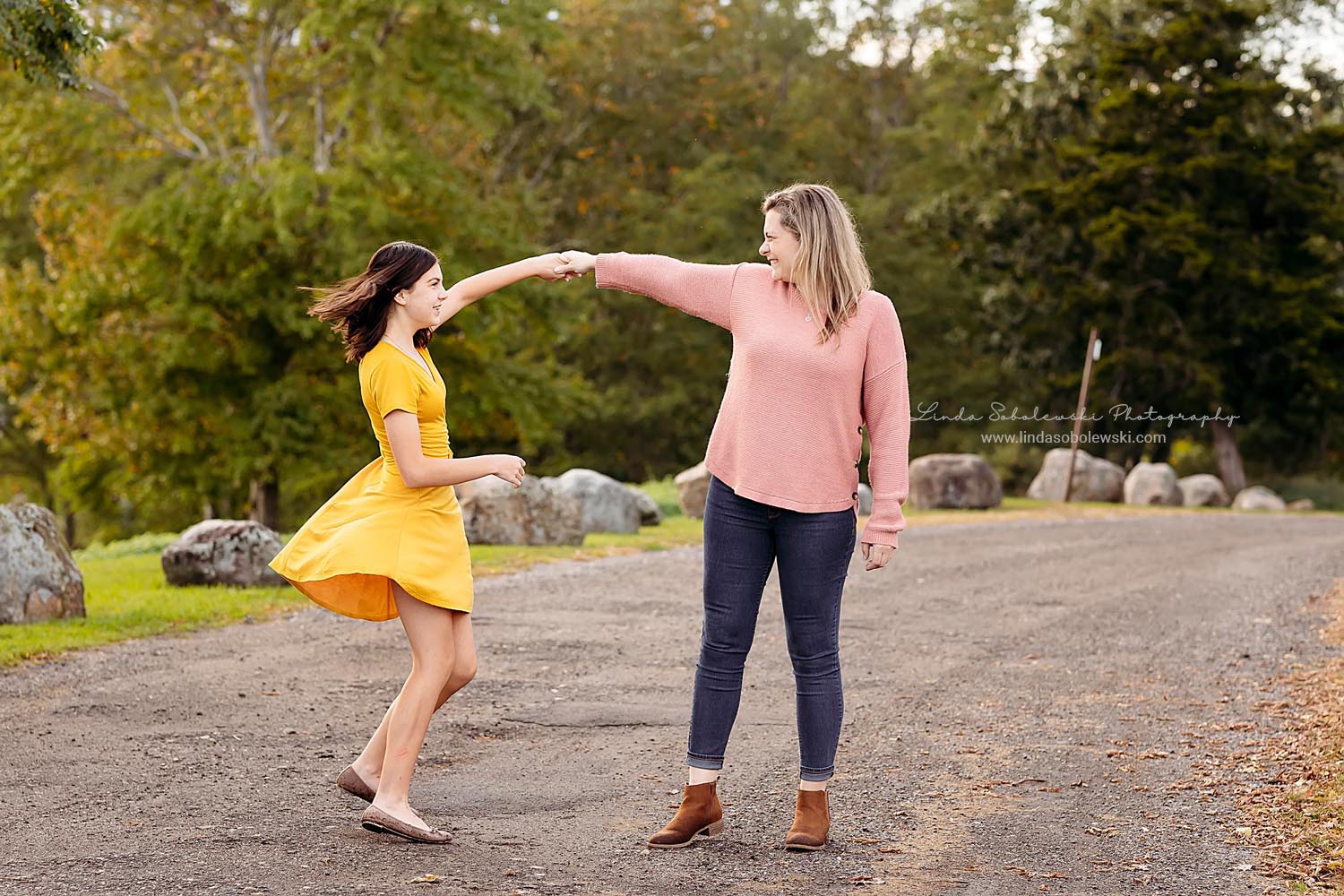 mom spinning her daughter around, CT Shoreline family photographer