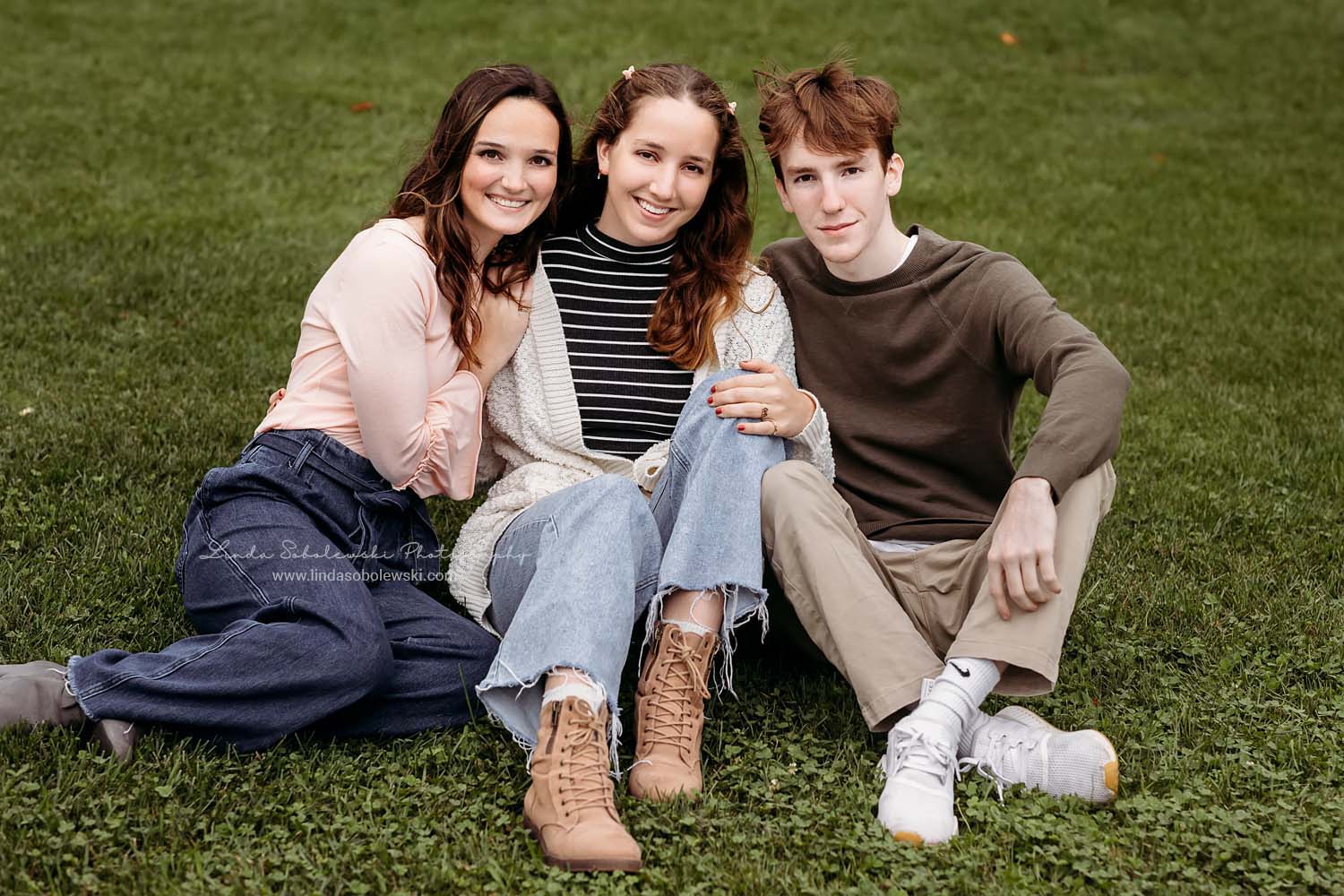 three teenage siblings sitting together, CT shoreline photographer