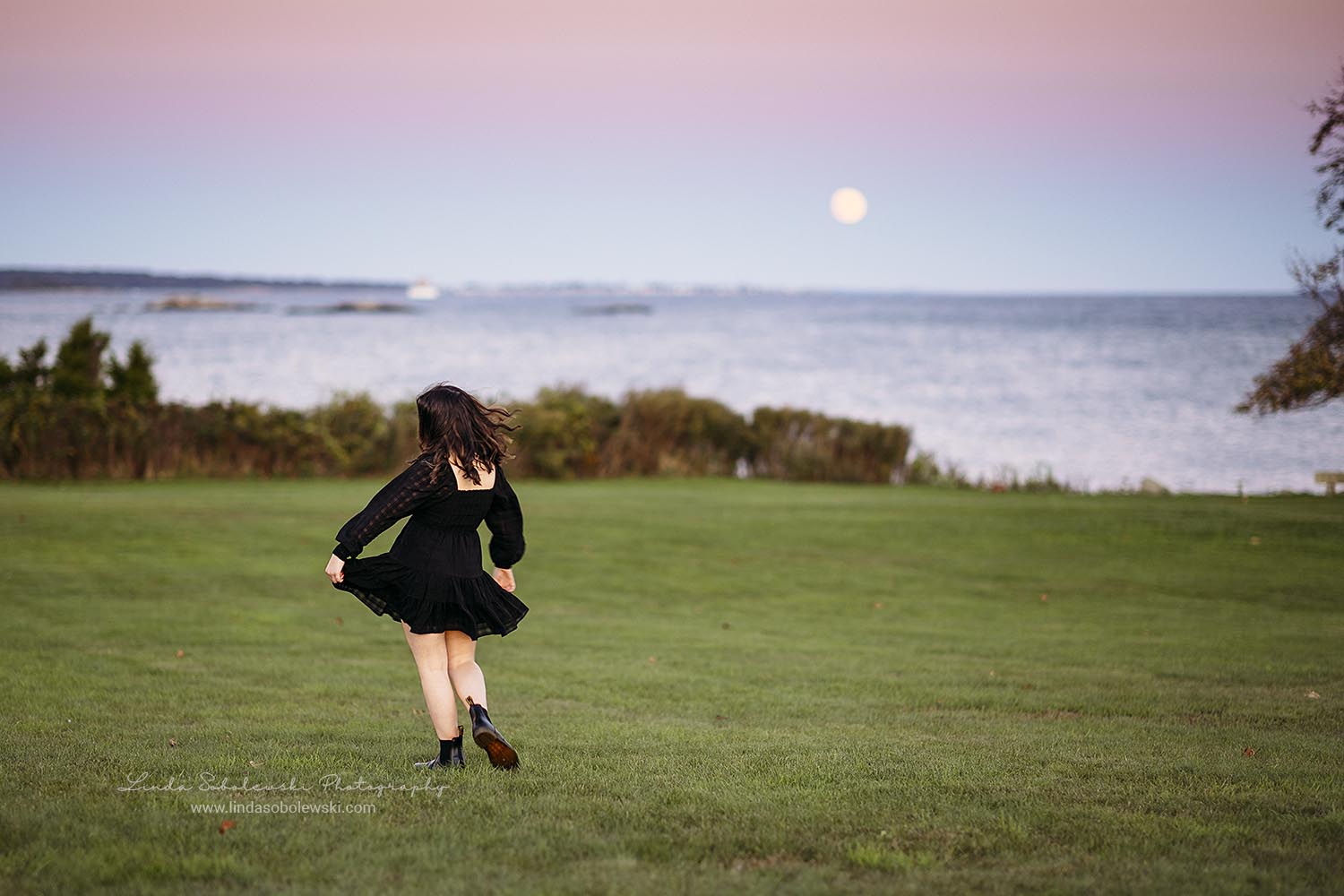 girl in black dress spinning around, CT Shoreline senior photographer