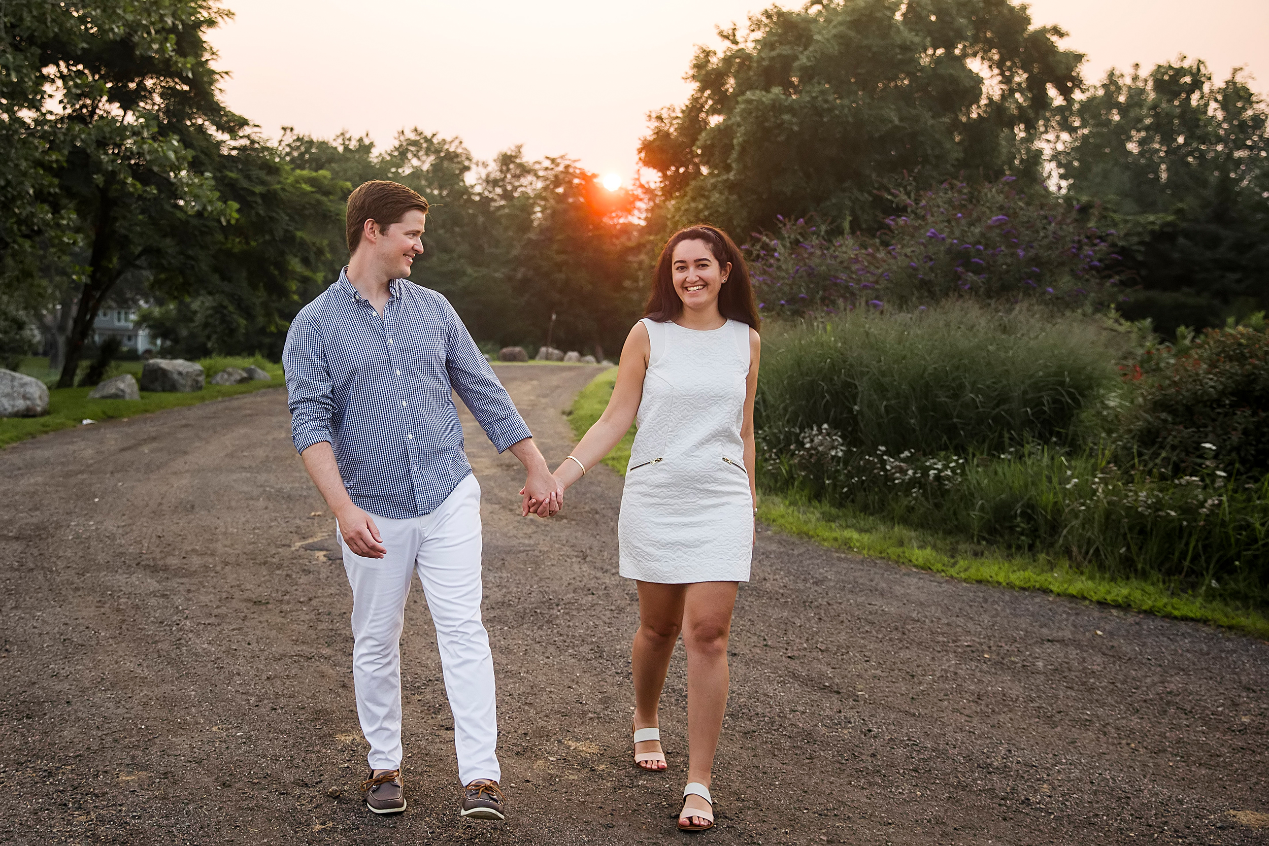 man in blue shirt holding hands with woman in white dress, CT family photographer, blog post for What Not To Wear for family photos