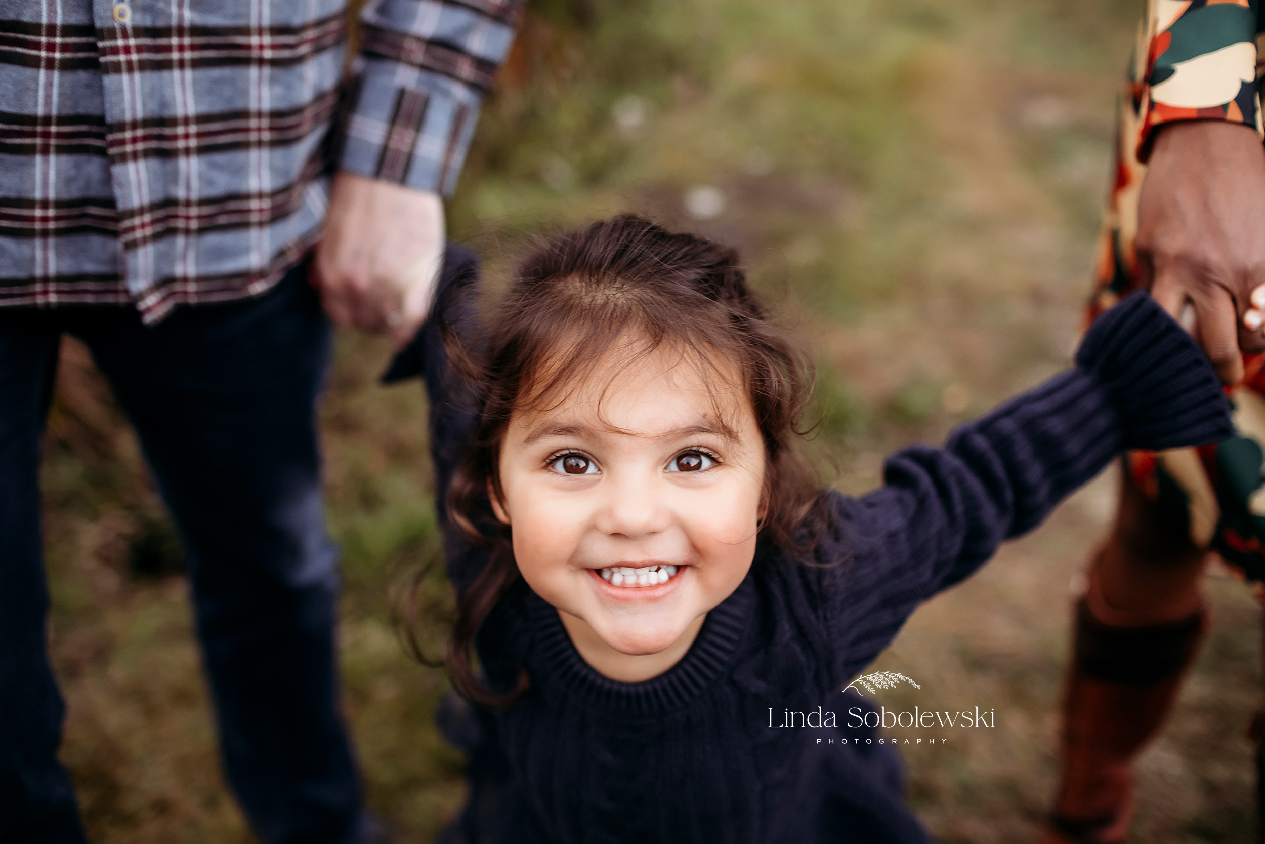 little girl in blue dress smiling at the camera, Madison CT Family photographer - what to do if your child won't cooperate