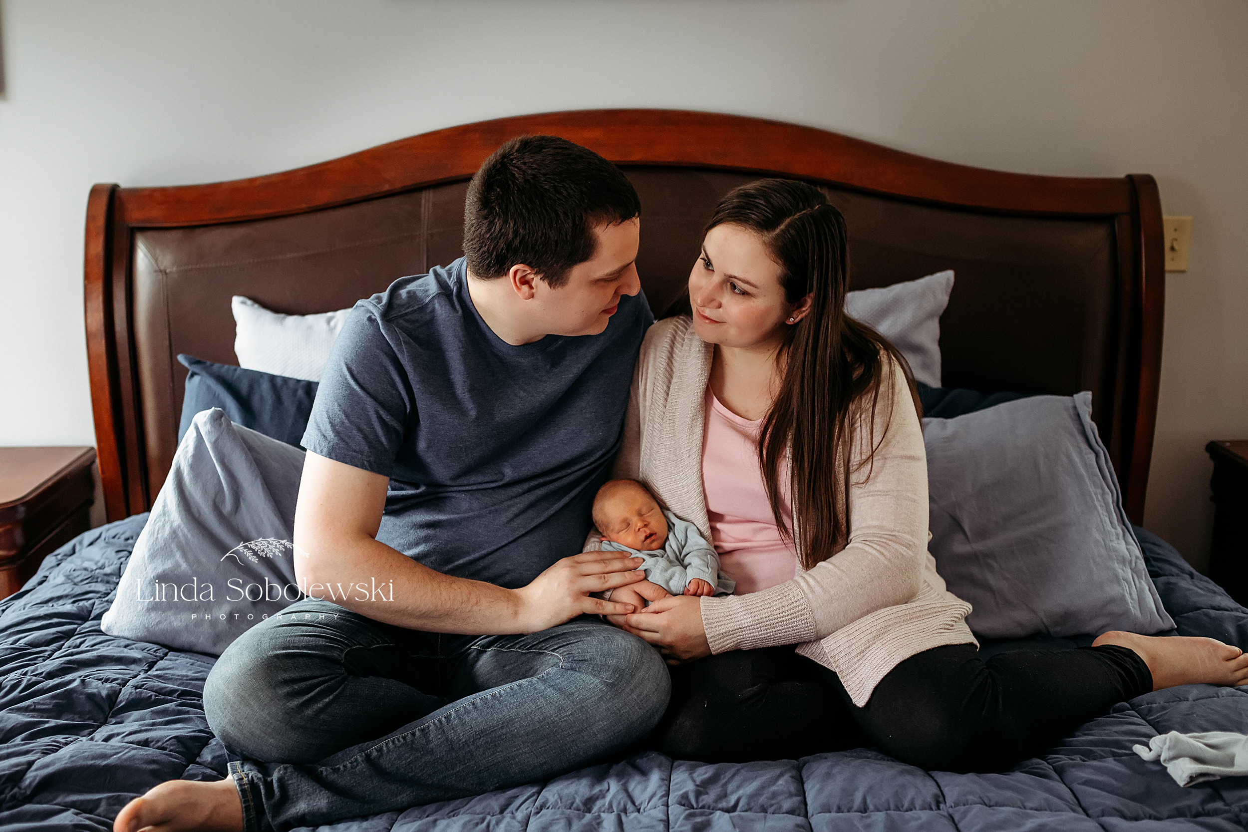 parents looking down at their newborn baby, Guilford CT Newborn photographer