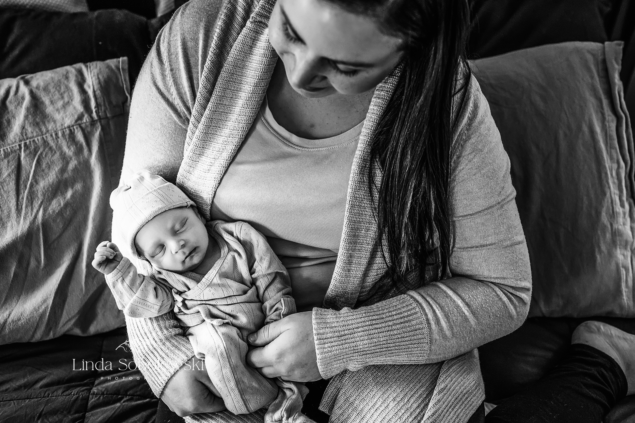 black and white image of mom holding her newborn baby, Connecticut's Best Newborn Photographer