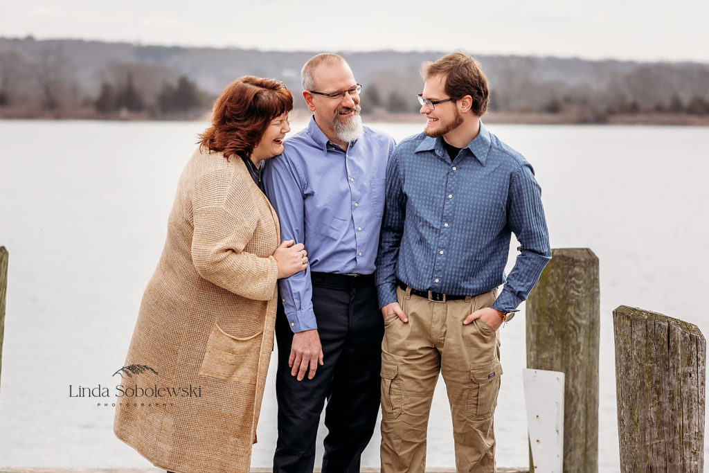 three adults laughing with each other, Essex, CT family photographer