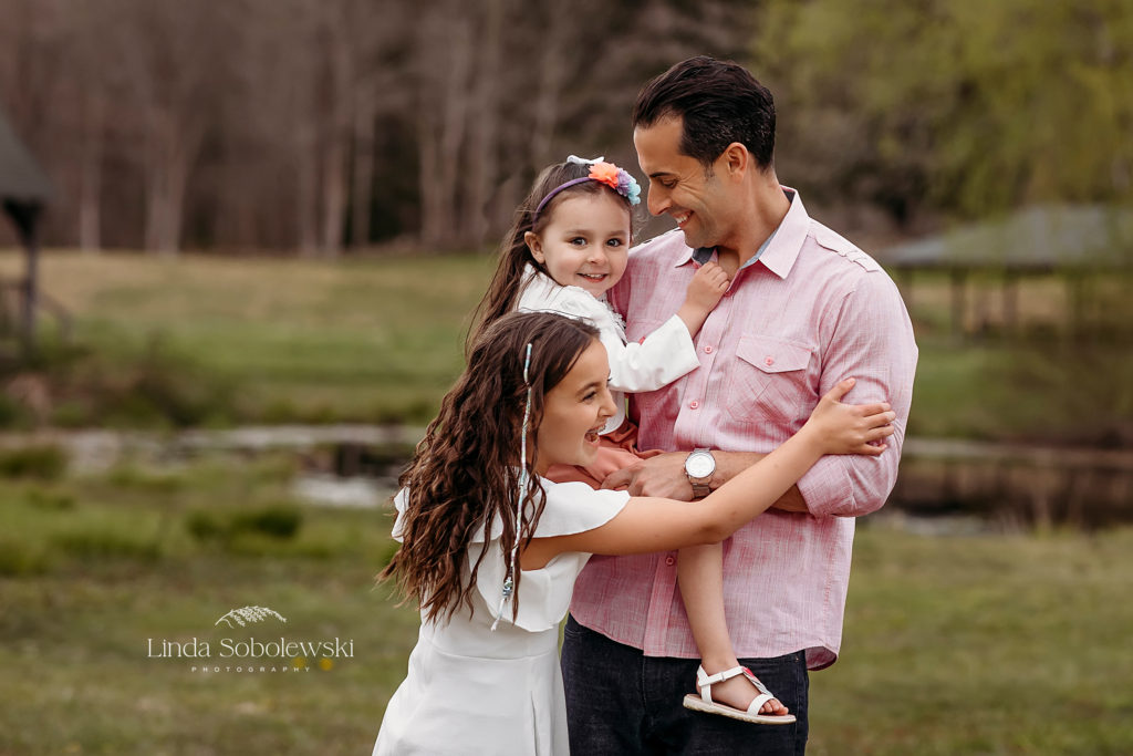 dad playing with his two daughters, favorite dad images for CT Shoreline photographer