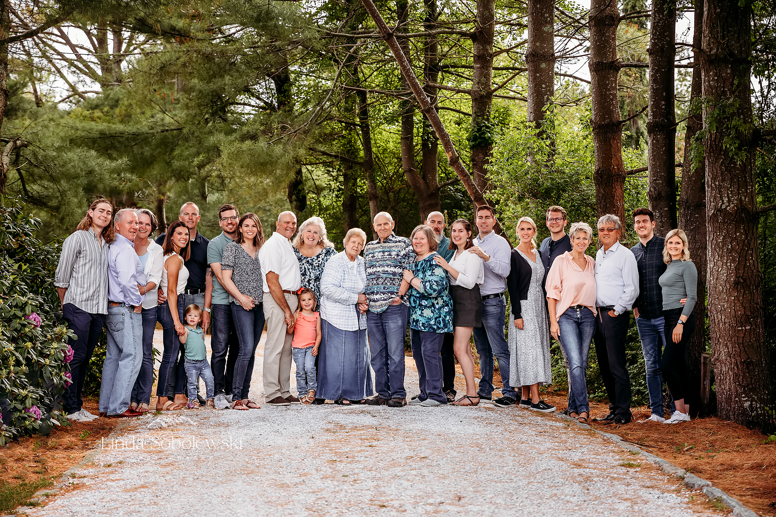 large family standing together under trees, a large family photo session, Westbrook Ct photographer