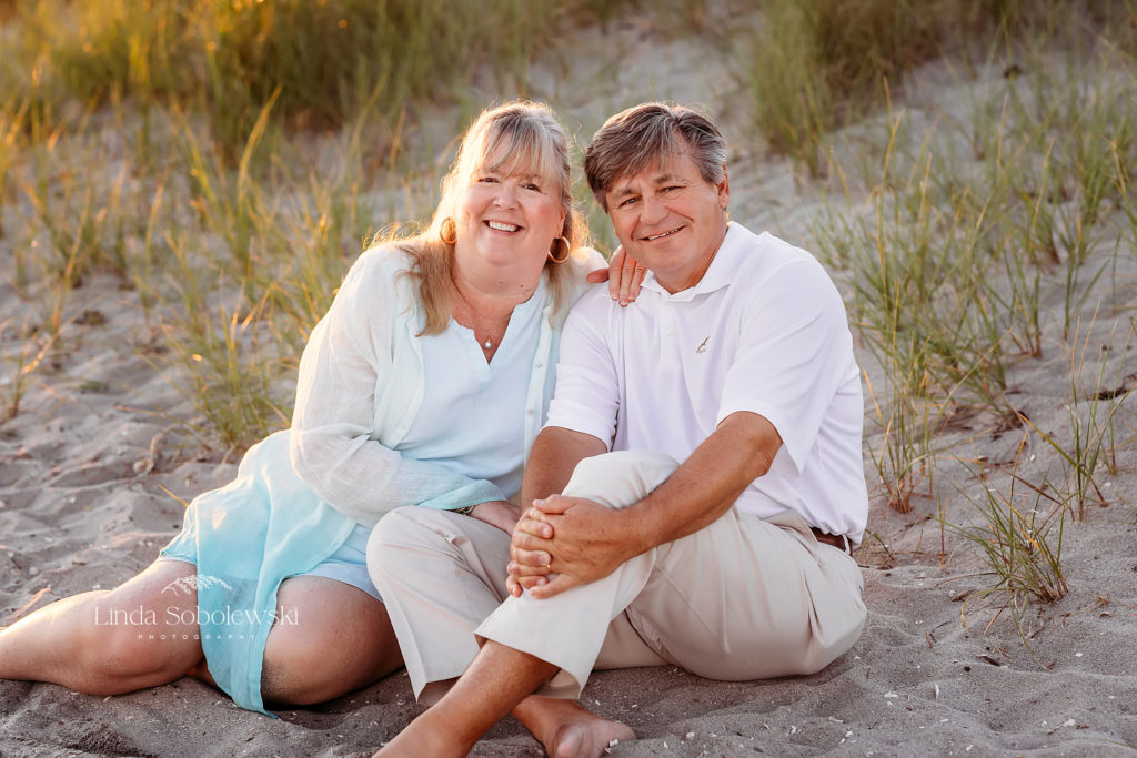 couple sitting together at the beach, CT extended family photography session