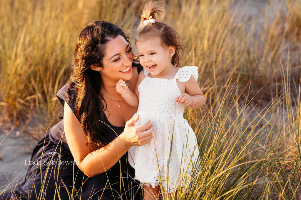 mom playing with her little girl at the beach, Big family photo shoot at the beach, CT Extended Family Photographer