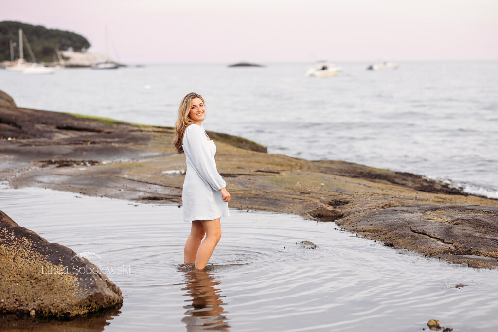 girl in blue dress in the water at the beach, Senior Photos in Madison CT