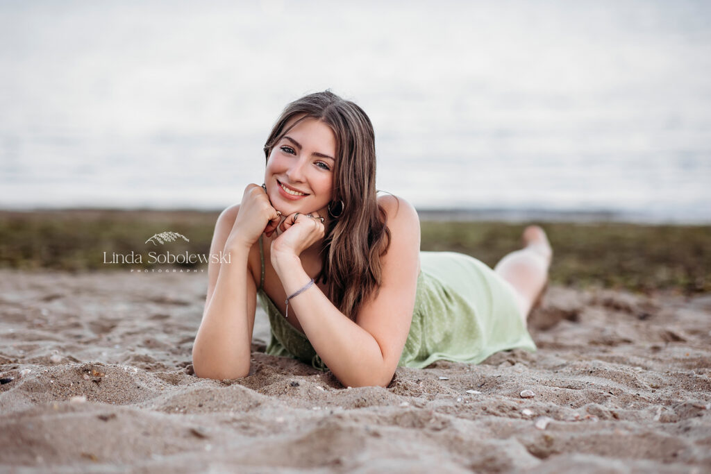 girl laying on the beach, A senior photo shoot in Essex CT 