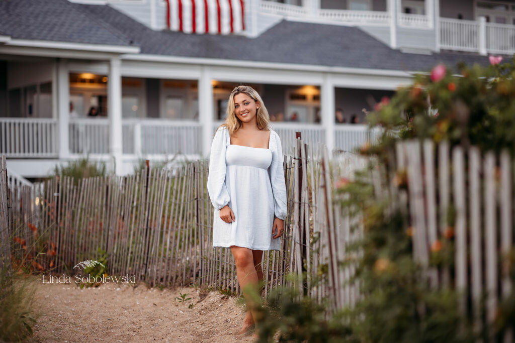 girl with blonde hair standing at the beach, Guilford CT Senior photographer