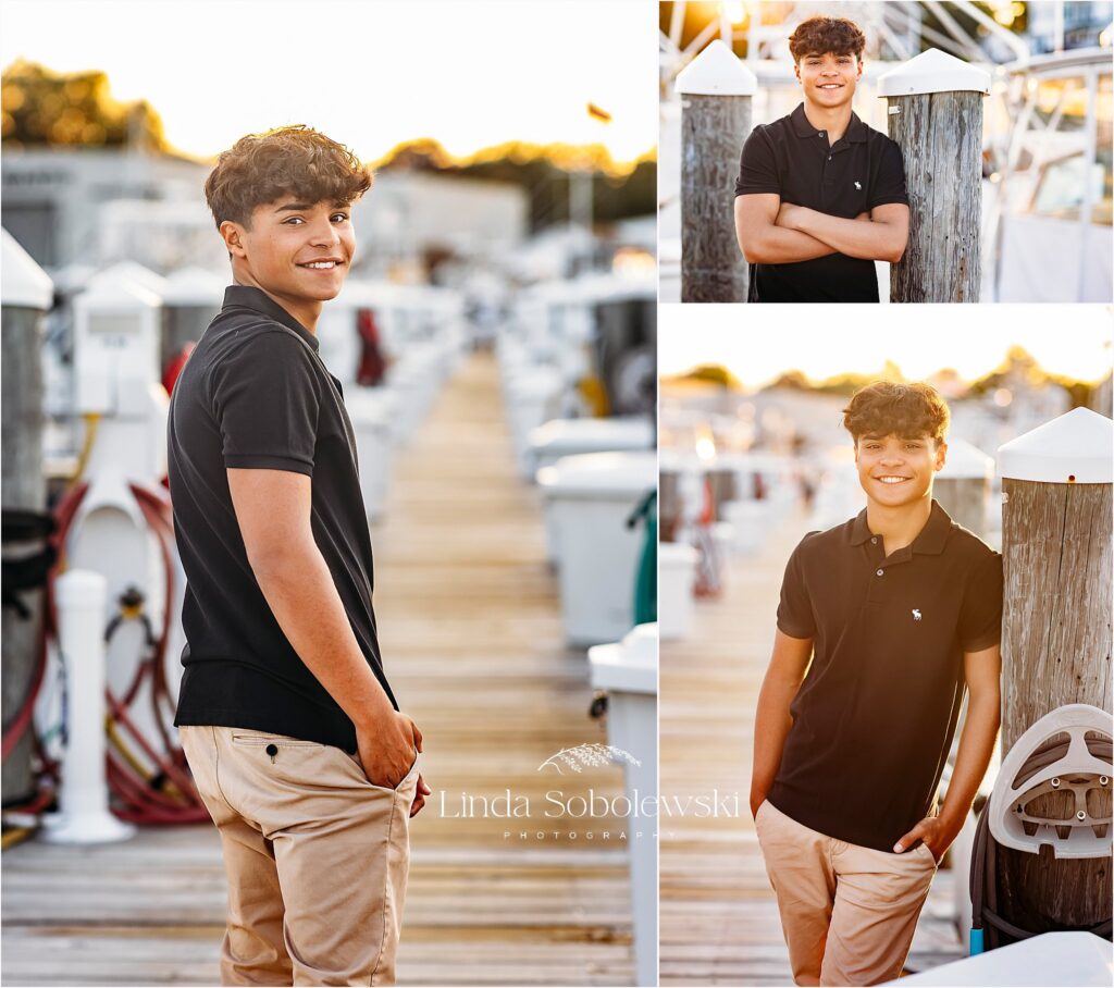 teenage boy in navy shirt, getting his senior photos take on a boat, CT Shoreline senior photographer