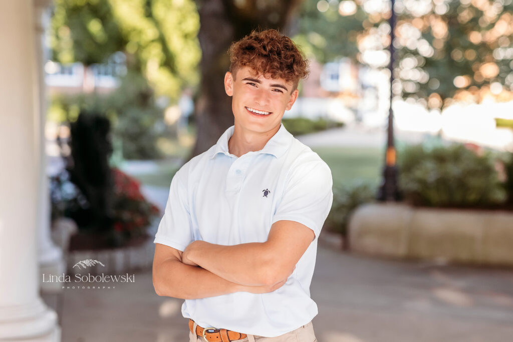 teenage boy in white shirt with his arms crossed, CT Senior Photographer