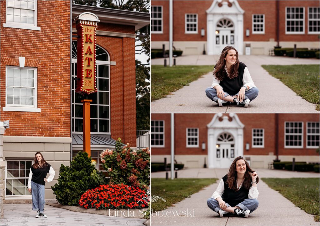 girl with black sweater and jeans standing in front of the Kate in downtown Old Saybrook CT for her senior photo session