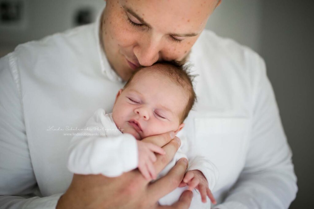 father holding his newborn baby girl, CT Shoreline baby photographer