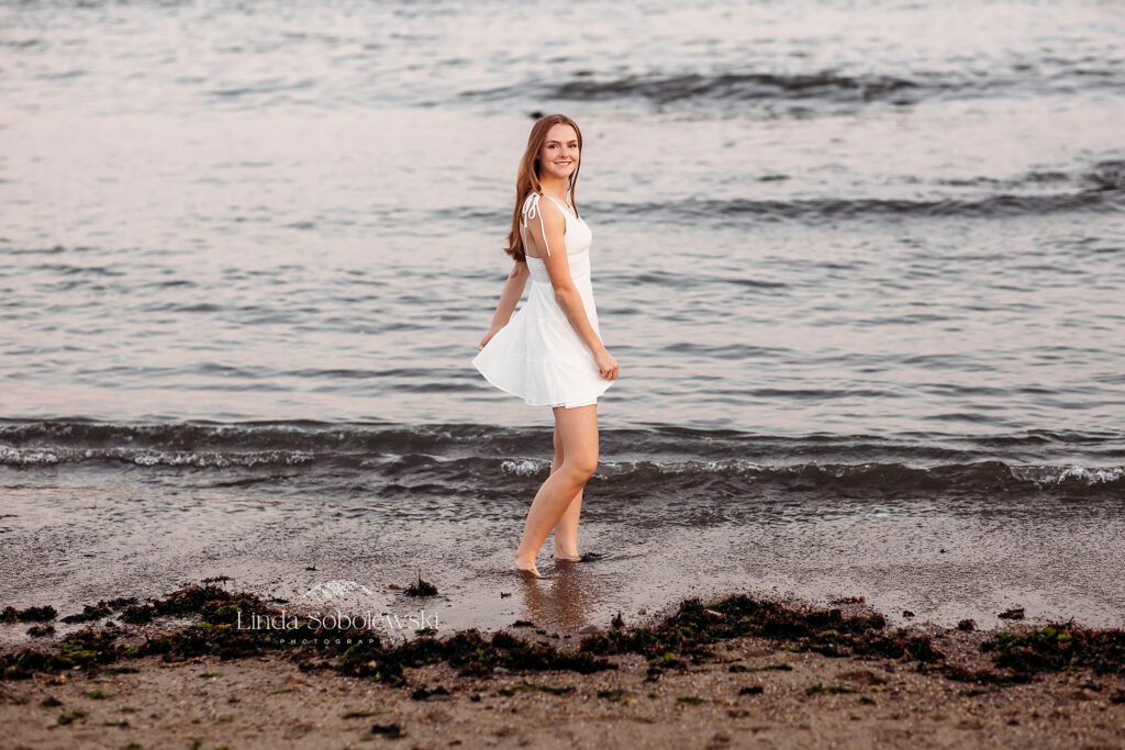 teenage girl in white dress at the beach, Westbrook and Madison CT Senior photographer