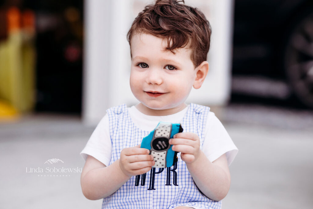 little boy in blue outfit eating a cookie, CT Best Family photographer