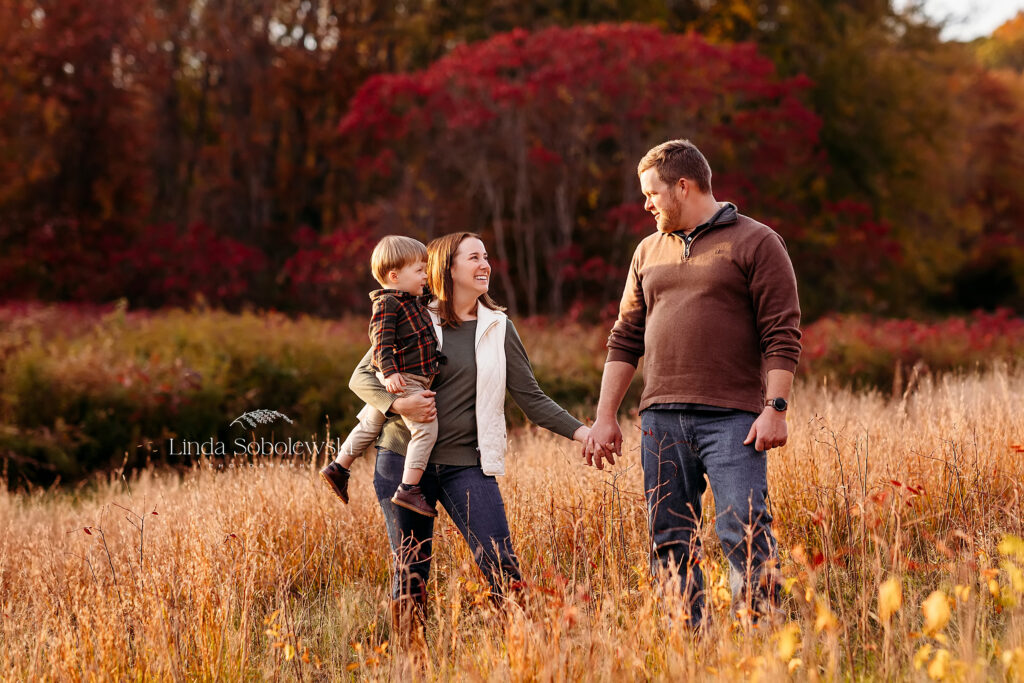 family walking together in a field, CT Shoreline Best photographer