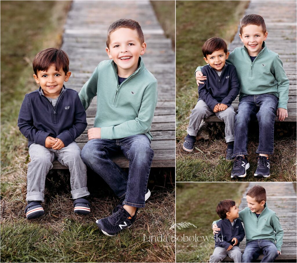 two little boys sitting together on a walkway at a park, Extended Family Photo Shoot in Madison CT
