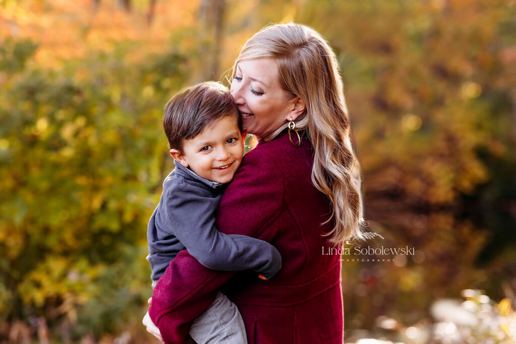 woman in red coat holding her little boy, CT Best Family photographer