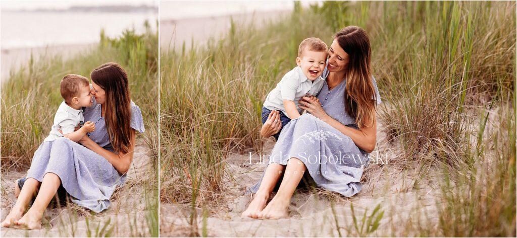 mom in blue dress sitting on the beach with her little boy, Guilford CT family photographer