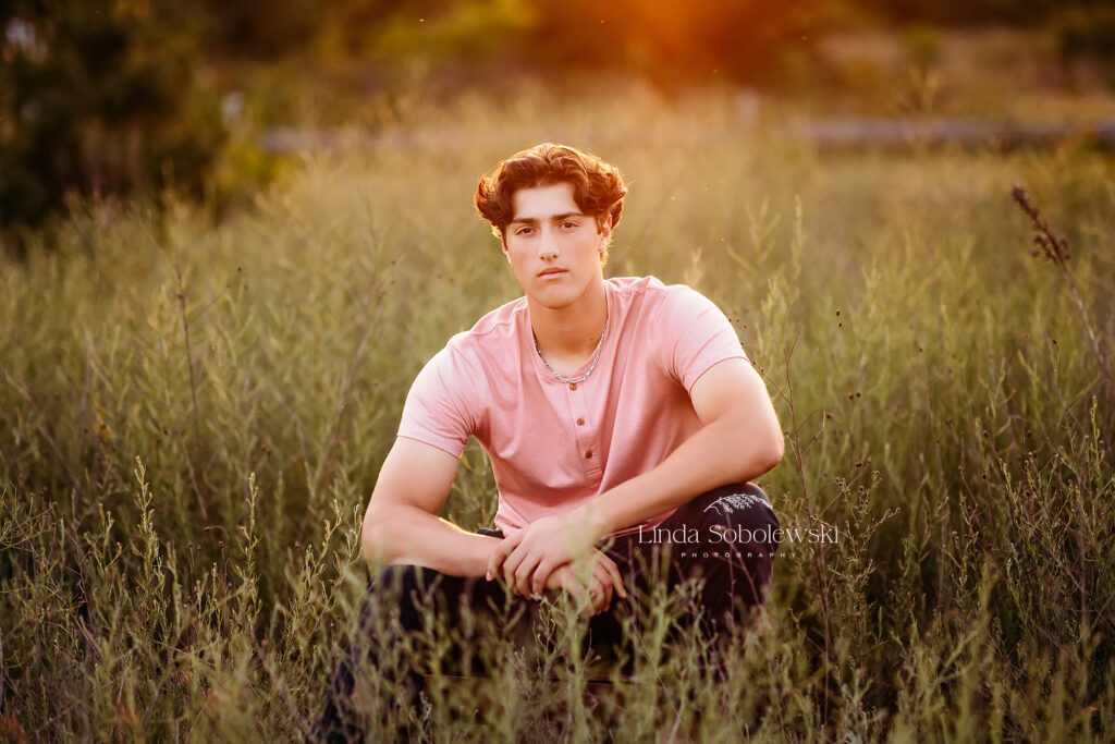 teenage boy sitting in a field, Senior Boy photo session