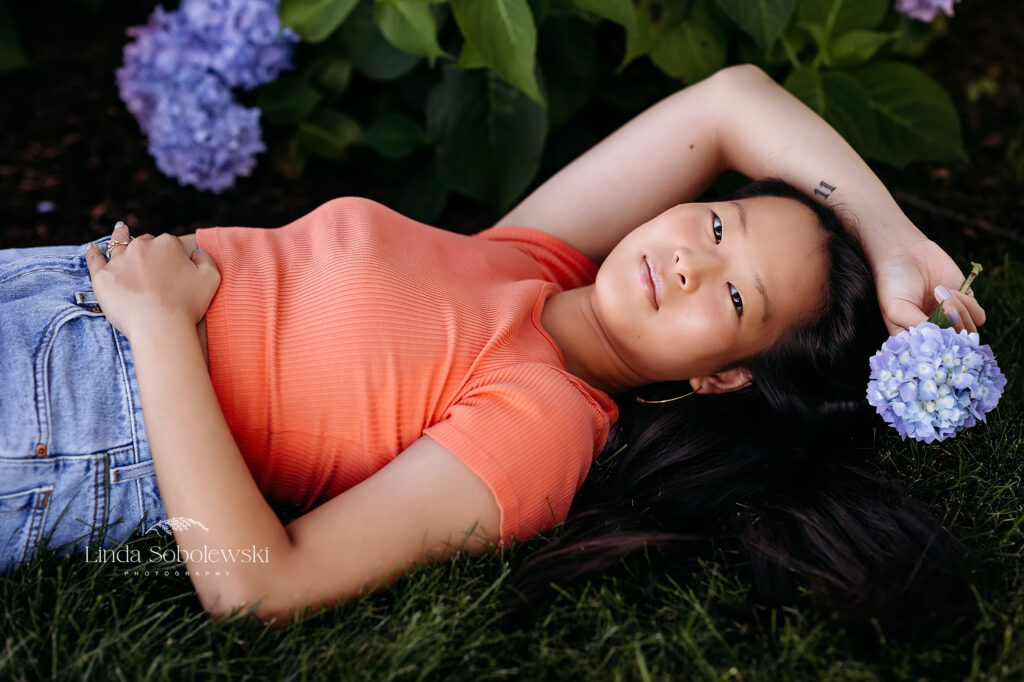 girl laying down on the grass, Old Saybrook CT senior photographer