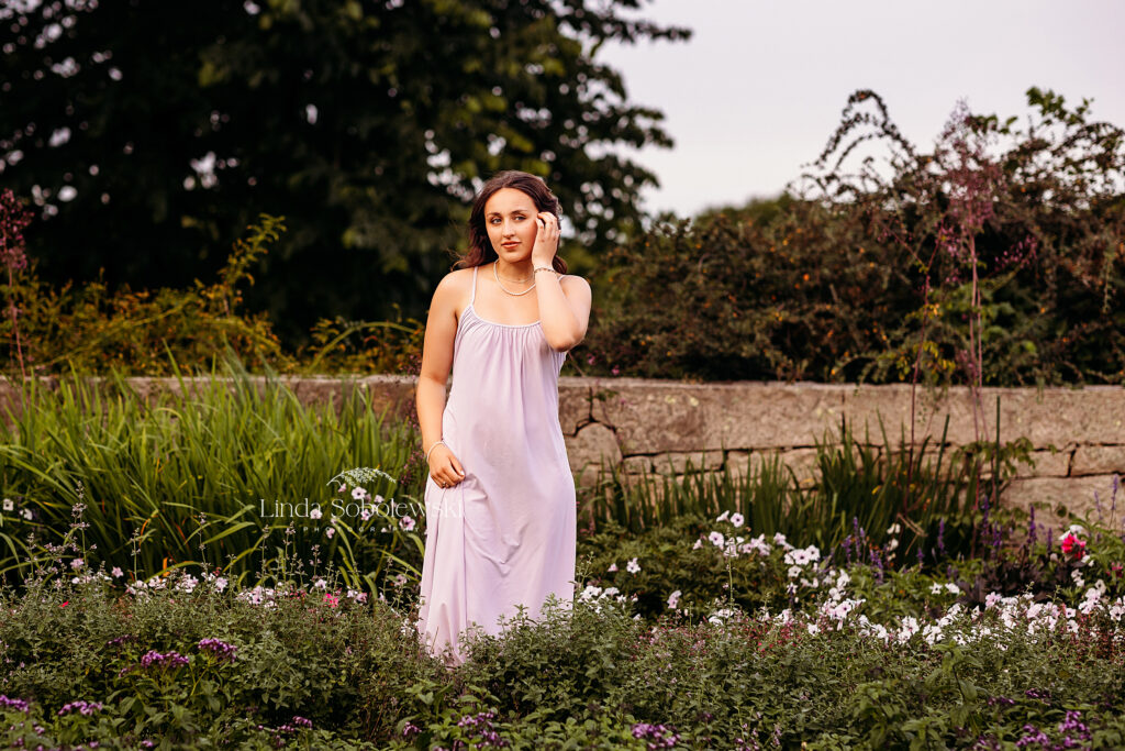 girl with black hair and purple dress in a garden, Senior Photos at Harkness Park