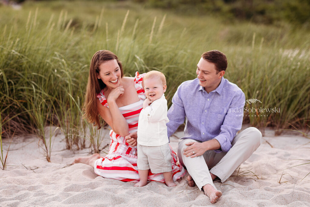 adorable little boy at the beach with his parents, CT photographer