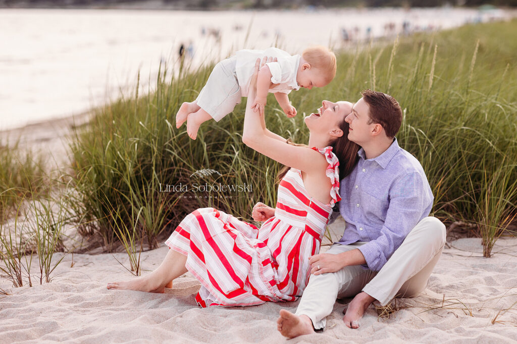 mother and father holding their baby up, CT Family photographer